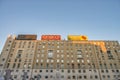 MILAN, ITALY - SEPTEMBER 2015: City buildings with advertisings at sunset