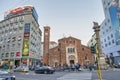 MILAN, ITALY - SEPTEMBER 2015: City buildings with advertisings at sunset