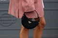 Milan, Italy - September 21, 2023: fashioner wearing Prada Arque black shoulder bag. Fashion blogger outfit details Royalty Free Stock Photo