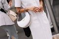 Milan, Italy - September 21, 2023: fashioner wearing Prada Arque white shoulder bag. Fashion blogger outfit details Royalty Free Stock Photo