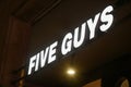 Five Guys logo displayed on a facade of a store in Milan Royalty Free Stock Photo