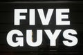Five Guys logo displayed on a facade of a store in Milan Royalty Free Stock Photo
