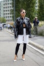 Karina Nigay with black leather jacket, white bermuda and high heel shoes before MSGM fashion