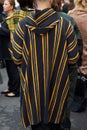 Man with black, yellow, gray striped hoodie before Boss fashion show, Milan Fashion Week street