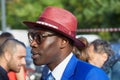 Man with red Borsalino hat and blue jacket before Tods fashion show, Milan Fashion Week street Royalty Free Stock Photo