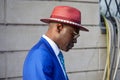 Man with red Borsalino hat and blue jacket before Tods fashion show, Milan Fashion Week street Royalty Free Stock Photo