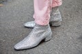 Man with silver glitter shoes and pink trousers before Giorgio Armani fashion show, Milan