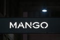 Mango logo displayed on a facade of a store in Milan