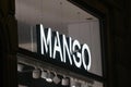 Mango logo displayed on a facade of a store in Milan