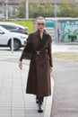 Mary Leest with brown coat before Tods fashion show, Milan Fashion Week street style