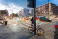 MILAN, ITALY - September 06, 2016: Red colored bicycle parked fastened by lock to the street pole in Milana Royalty Free Stock Photo