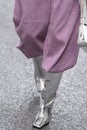 Milan, Italy - September, 21, 2022: Street style outfit, woman wears pale purple wool large pants, silver shiny