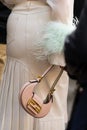 Milan, Italy - September, 21, 2022: Stylish woman wearing bag Fendi Cookie Pale pink leather mini bag, street style