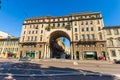 MILAN, ITALY - September 06, 2016: View on the old building with arch, columns and balconies with flowers