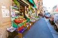 MILAN, ITALY - September 07, 2016: View on the street shop - grocery -with fruits and vegetables on shopboard in th