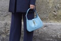 Woman with blue leather Gucci bag before Max Mara fashion show, Milan Fashion Week street style