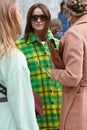 Woman with green and yellow checkered coat before Sportmax fashion show, Milan Fashion Week