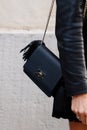 Milan, Italy - September, 25: woman influencer wearing shoulder bag with tassels from Elisabetta Franchi. Fashion