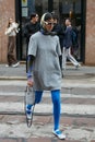 Woman with Prad bag, blue stockings and head scarf before Calcaterra fashion show, Milan Royalty Free Stock Photo