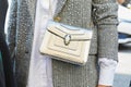 Woman with silver Bulgari bag before Ermanno Scervino fashion show, Milan Fashion Week street