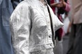 Milan, Italy - September, 21, 2022: woman wearing silver cropped jacket and matching embroidered rhinestones skirt