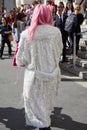 Woman with white and silver coat and pink hair before Genny fashion show, Milan Fashion Week