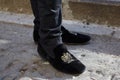 Man with black velvet loafers with golden embroidery before Wood Wood fashion show, Milan Fashion Week street