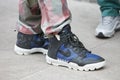 Man with blue and black Nike sneaker shoes before Giorgio Armani fashion show, Milan Fashion Week street style