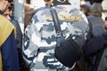 Man with gray camouflage jacket and black leather pouch before Marni fashion show, Milan Fashion Week street