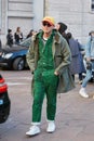 Man with green zebrine overalls and Dhl cap before Salvatore Ferragamo fashion show, Milan Fashion Week street Royalty Free Stock Photo