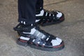 Man with Wolftotem black leather sandals with white socks before MSGM fashion show, Milan Fashion Week street Royalty Free Stock Photo