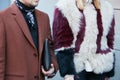 Man and woman with brown jacket and dark red and white fur before N 21 fashion show, Milan Fashion Week street Royalty Free Stock Photo