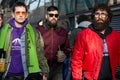 Three men walking in green and red before Emporio Armani fashion show, Milan Fashion Week street style on