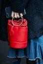 Woman with red Gazel bag and blue fur coat before Pal Zileri fashion show, Milan Fashion Week street style on Royalty Free Stock Photo