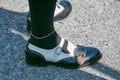 Man with black and white leather Gucci shoes and golden anklet before Prada fashion show, Milan Fashion Week Royalty Free Stock Photo