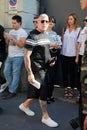 Nick Wooster with black t-shirt and bermuda shorts before Prada fashion show, Milan Fashion Week street style on