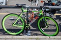 Single speed green bike with stickers seen before Pal Zileri fashion show, Milan Fashion Week street style on