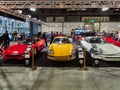 Milan, Lombardy Italy - November 23 , 2018 - From left to right, red Ferrari F355 Spider 1996, yellow Porsche 911 2.0 Serie O SWB