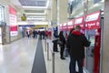 Tourists buying tickets from a ticket machine