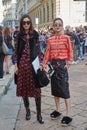 Elegant women before Salvatore Ferragamo fashion show, Milan Fashion Week street style on September 25, 2016