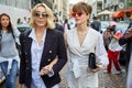 Elegant women with sunglasses before Antonio Marras fashion show, Milan Fashion Week street style on