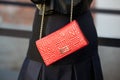 Fendi red bag seen before Fendi show during Milan Fashion Week Day 2, Spring / Summer 2016 street style Royalty Free Stock Photo