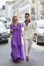 Frank Galluccio with woman with purple dress before Ermanno Scervino fashion show, Milan Fashion Week street