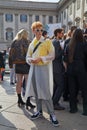 Guest with transparent raincoat and Vans black and white shoes before Gabriele Colangelo fashion show, Milan Royalty Free Stock Photo