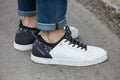 Man with black and white Hogan rebel shoes before Max Mara fashion show, Milan Fashion Week street style on