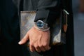 Man with Rolex Air King watch with blue dial and Louis Vuitton bag before Gabriele Colangelo fashion show,