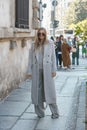 Nina Suess with with long wool beige coat and sunglasses before Max Mara fashion show, Milan Fashion Week