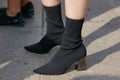 Woman with black boots with mirror heels before Gabriele Colangelo fashion show, Milan Fashion Week street