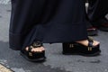 Woman with black high sandals and silver nail polish before Wunderkind fashion show, Milan Fashion Week