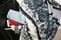 Woman with black and white cloak with fringes before Gabriele Colangelo fashion show, Milan Fashion Week